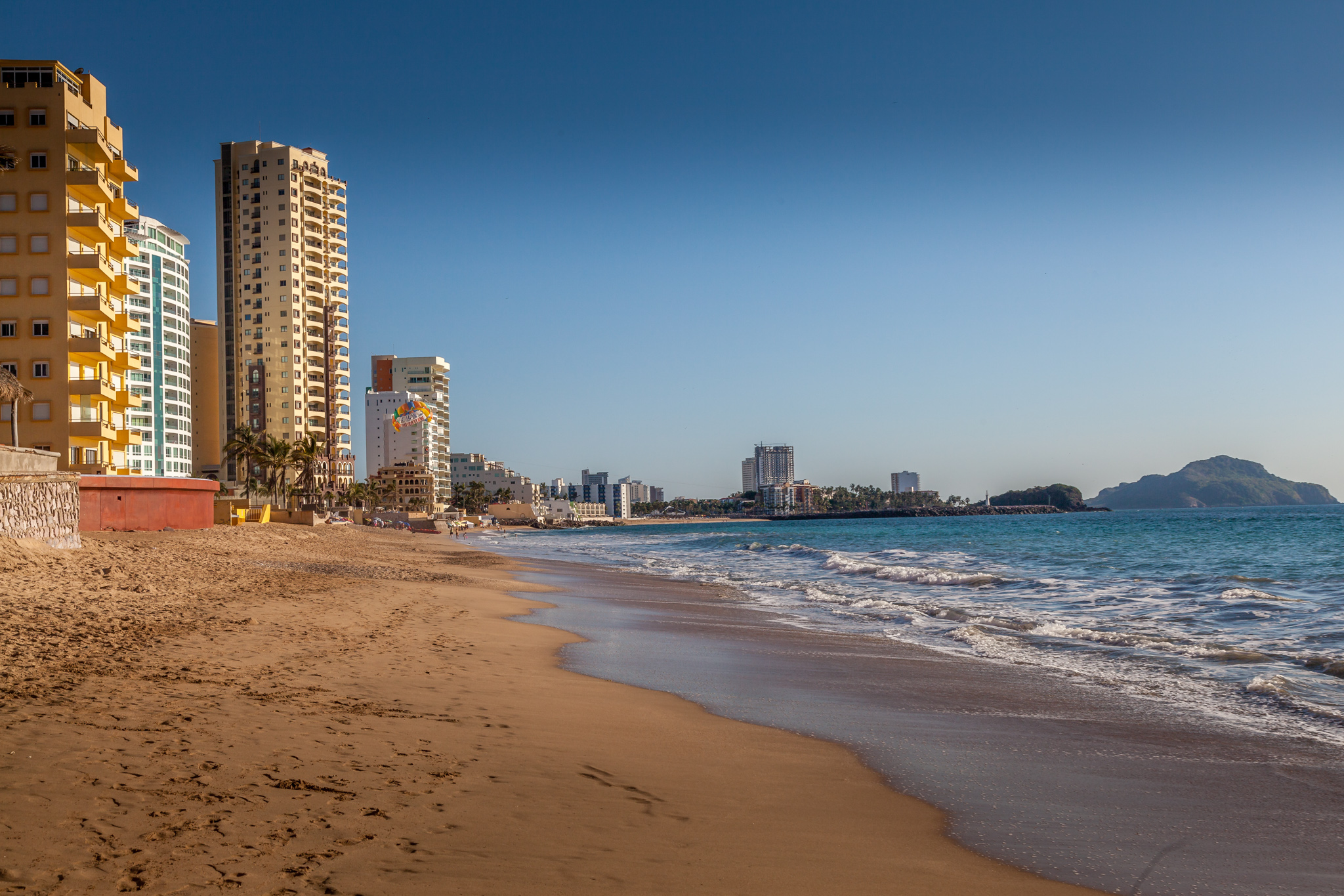 Sandy beach and Pacific shoreline in Mazatlán, photographed by Bill Bell